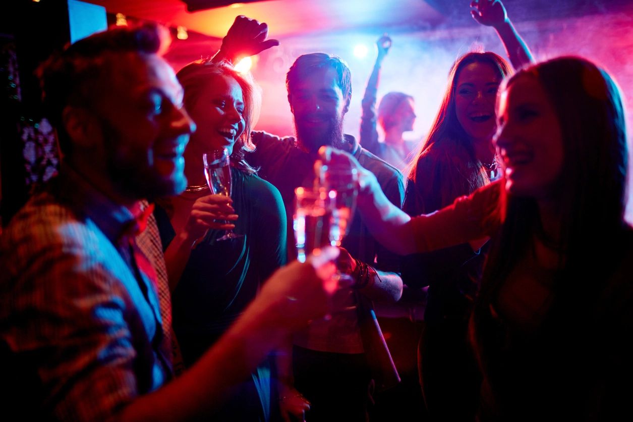 A group of people are drinking at a party.