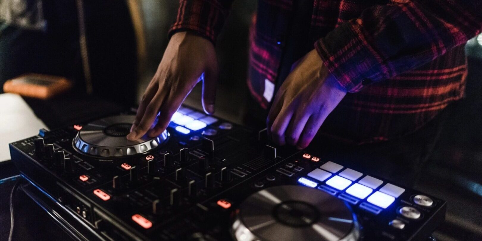 A person is playing some music on the dj equipment.