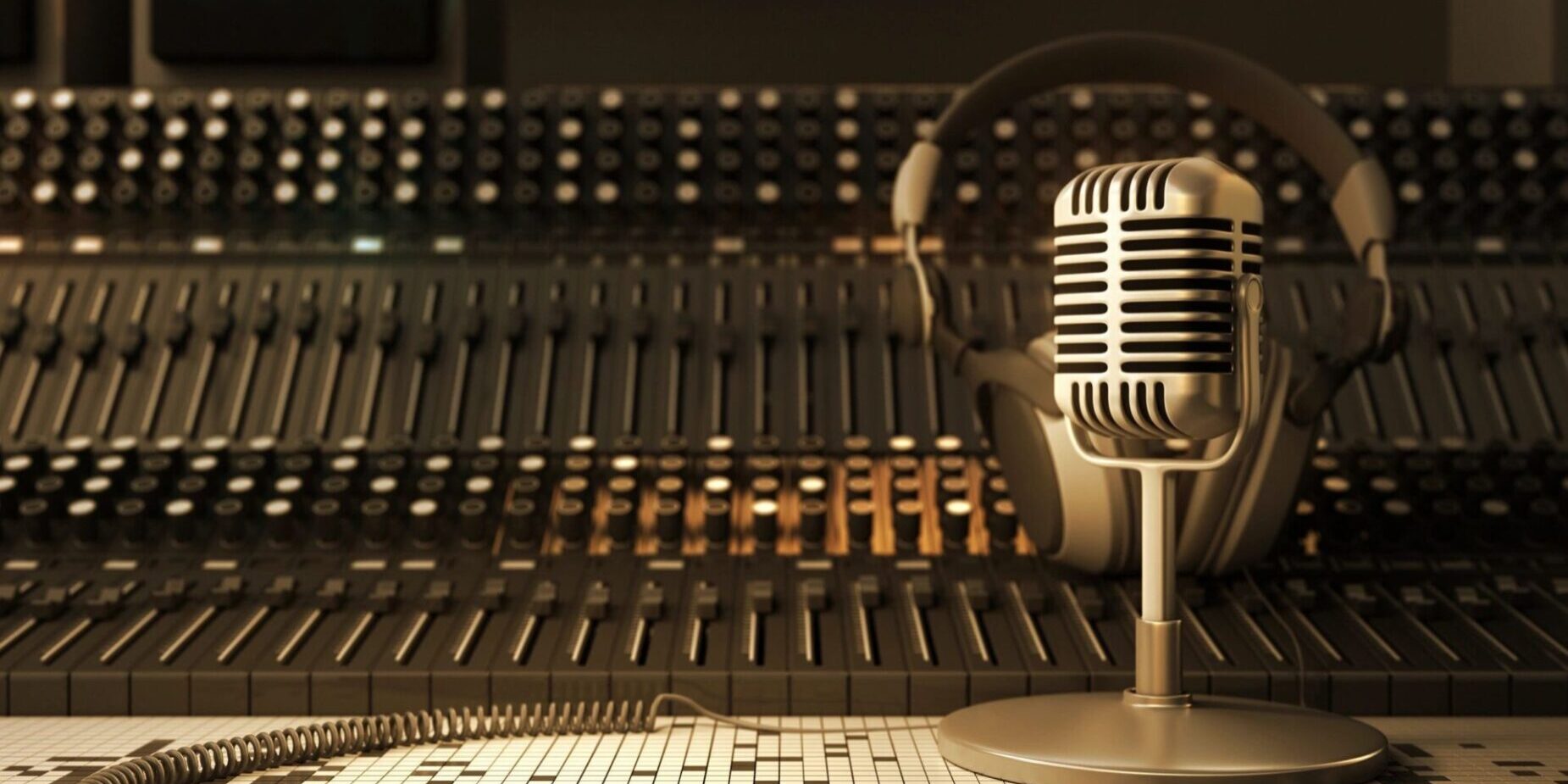 A microphone and headphones on top of a table.